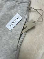 FORMLESS SS22 Fear of God Essentials Light Oatmeal Oversized Fleece Sweatpants | Streetwear